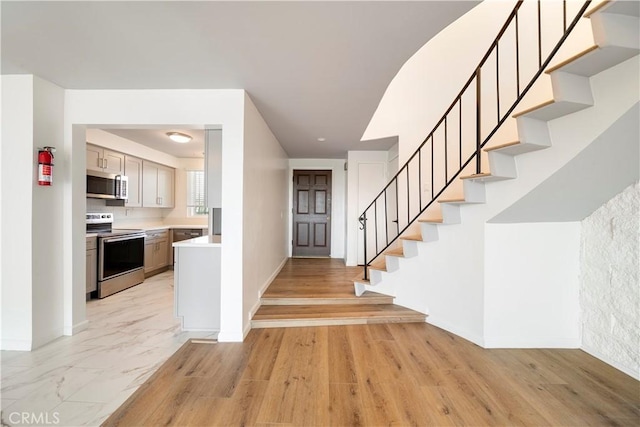 240 W Queen St Unit 10, Inglewood, CA 90301 - foyer entrance featuring baseboards and stairway