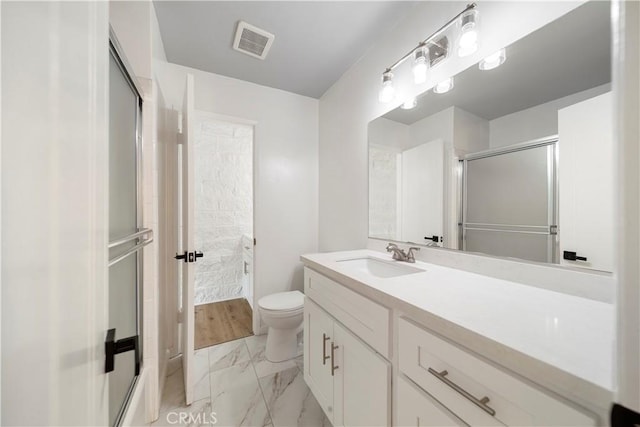 240 W Queen St Unit 10, Inglewood, CA 90301 - bathroom with marble finish floors, vanity, and a shower with door