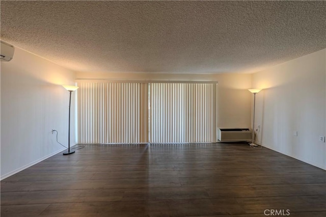 368 Avenida Castilla Unit B, Laguna Woods, CA 92637 - spare room featuring hardwood / wood-style flooring and a textured ceiling