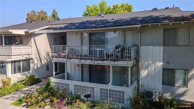 368 Avenida Castilla Unit B, Laguna Woods, CA 92637 - back of property with stucco siding, roof with shingles, and a balcony