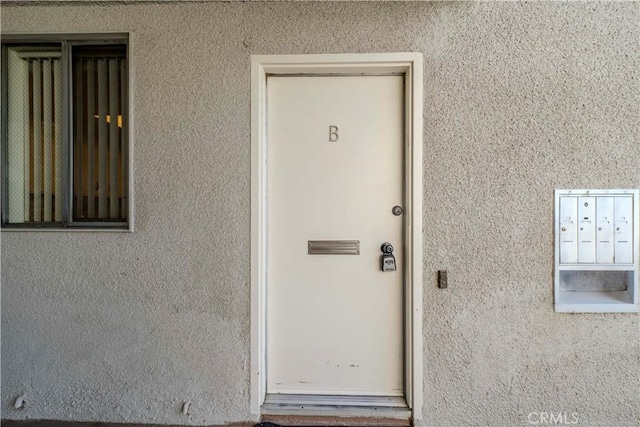 368 Avenida Castilla Unit B, Laguna Woods, CA 92637 - view of exterior entry featuring stucco siding