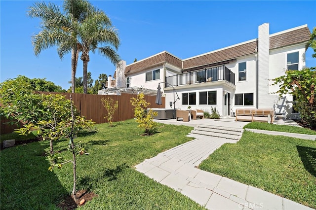 33 Seton Rd, Irvine, CA 92612 - back of property with a balcony, an outdoor hangout area, a hot tub, roof with shingles, and mansard roof