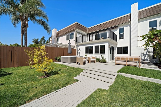33 Seton Rd, Irvine, CA 92612 - rear view of house with a balcony, outdoor lounge area, a hot tub, a patio area, and mansard roof
