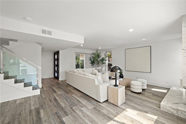 33 Seton Rd, Irvine, CA 92612 - living room with stairway, wood finished floors, and recessed lighting