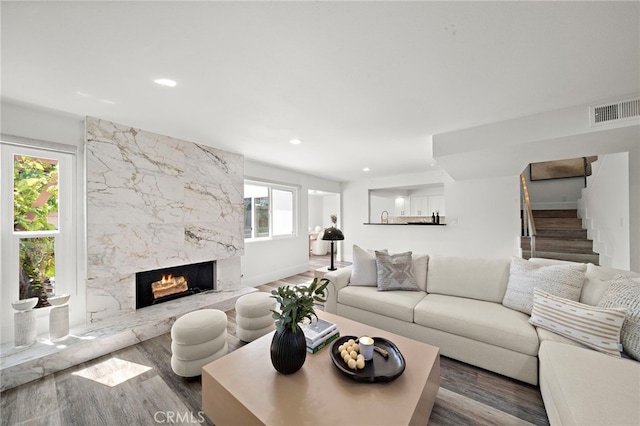 33 Seton Rd, Irvine, CA 92612 - living room featuring wood finished floors, stairs, a fireplace, and recessed lighting