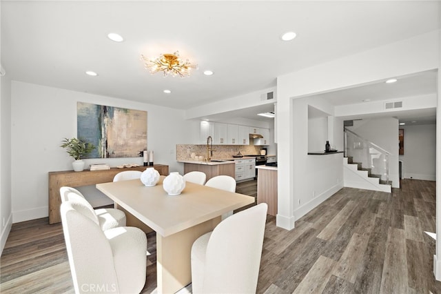 33 Seton Rd, Irvine, CA 92612 - dining space featuring wood finished floors, stairs, and recessed lighting