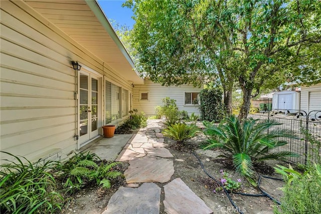 9700 Nita Ave, Chatsworth, CA 91311 - view of yard with french doors and a storage unit