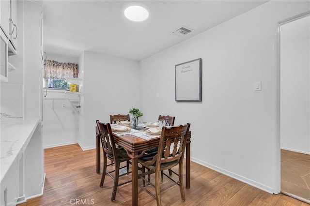 9700 Nita Ave, Chatsworth, CA 91311 - dining room featuring light wood-style floors and baseboards