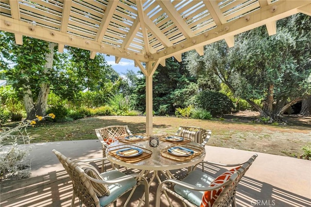 9700 Nita Ave, Chatsworth, CA 91311 - view of patio featuring outdoor dining area, a pergola, and view of scattered trees