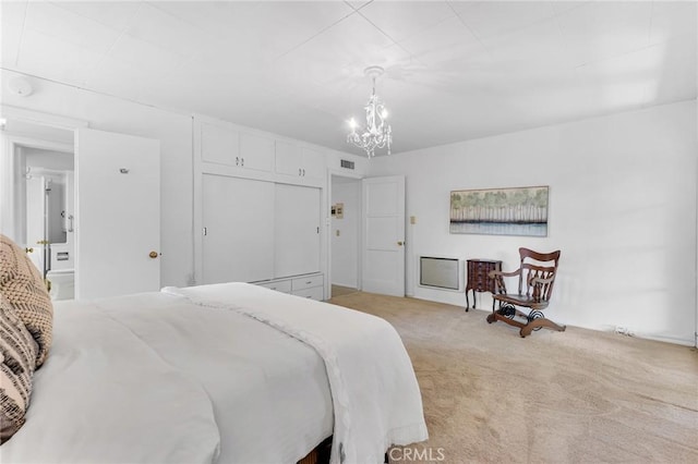 9700 Nita Ave, Chatsworth, CA 91311 - bedroom with light colored carpet, a chandelier, and a closet