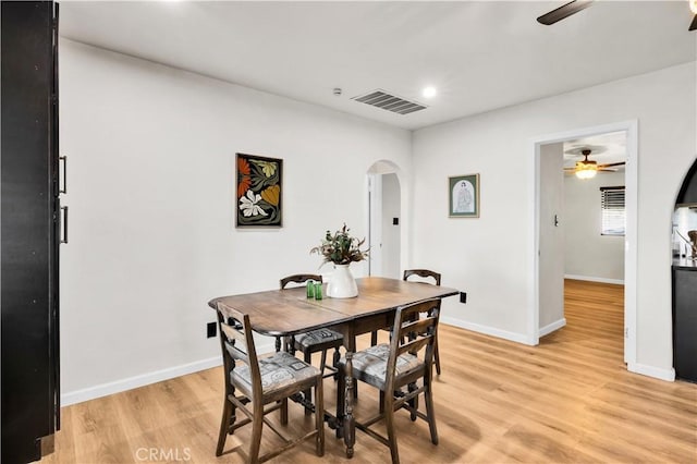 68613 E St, Cathedral City, CA 92234 - dining room with a ceiling fan, arched walkways, light wood-type flooring, and recessed lighting