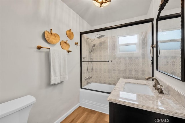 68613 E St, Cathedral City, CA 92234 - bathroom featuring vanity, bath / shower combo with glass door, and wood finished floors