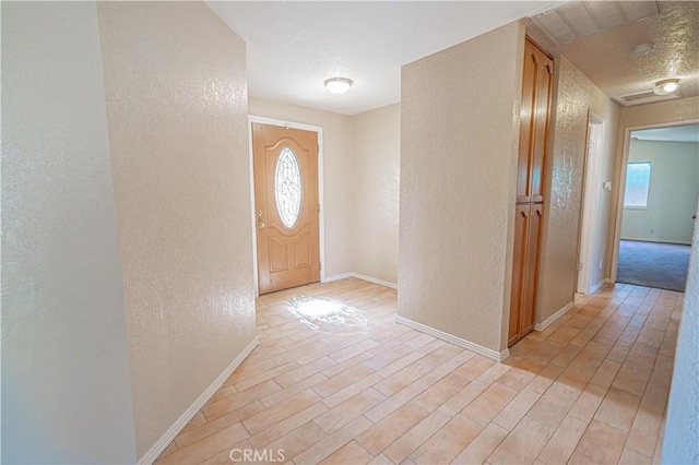 44623 Gingham Ave, Lancaster, CA 93535 - entrance foyer with a textured wall and light wood finished floors