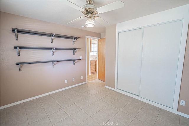 44623 Gingham Ave, Lancaster, CA 93535 - unfurnished bedroom with a closet, ceiling fan, and light tile patterned flooring