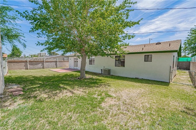 44623 Gingham Ave, Lancaster, CA 93535 - rear view of house with stucco siding, a fenced backyard, and a patio