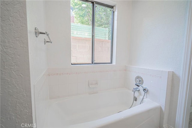 44623 Gingham Ave, Lancaster, CA 93535 - full bathroom featuring a textured wall and a garden tub