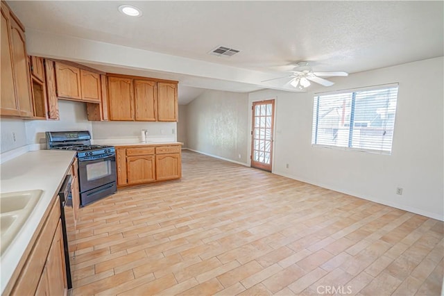 44623 Gingham Ave, Lancaster, CA 93535 - kitchen featuring gas stove, light countertops, ceiling fan, light wood finished floors, and recessed lighting