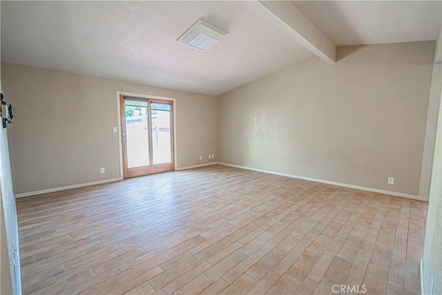 44623 Gingham Ave, Lancaster, CA 93535 - unfurnished room with light wood-type flooring and a textured ceiling