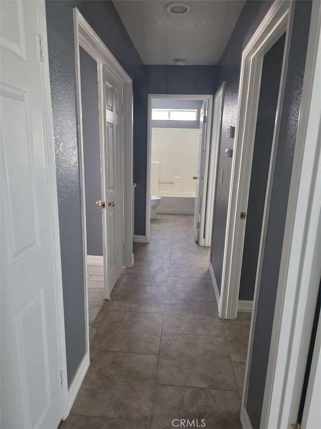 15171 San Jose Dr, Victorville, CA 92394 - corridor with baseboards