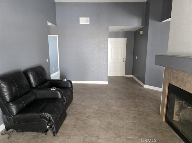 15171 San Jose Dr, Victorville, CA 92394 - living room with a tiled fireplace and baseboards