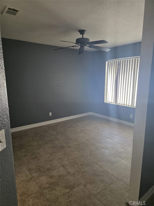 15171 San Jose Dr, Victorville, CA 92394 - spare room with a ceiling fan and a textured ceiling