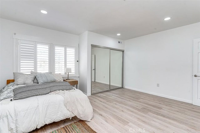 715 S Norton Ave, Los Angeles, CA 90005 - bedroom with light wood-type flooring, recessed lighting, and a closet