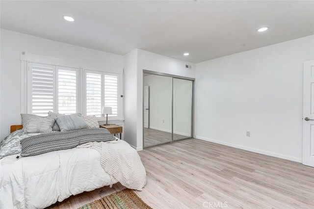 715 S Norton Ave, Los Angeles, CA 90005 - bedroom with light wood-style floors, recessed lighting, and a closet