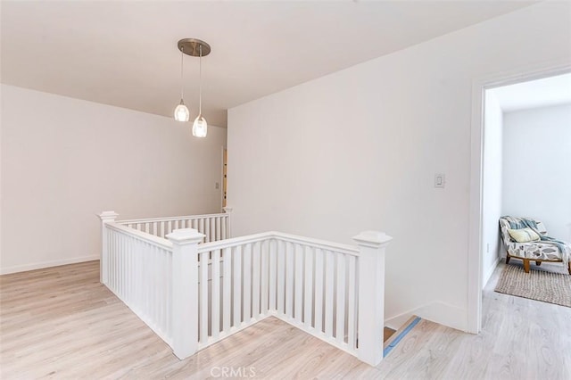 715 S Norton Ave, Los Angeles, CA 90005 - hall featuring an upstairs landing and wood finished floors
