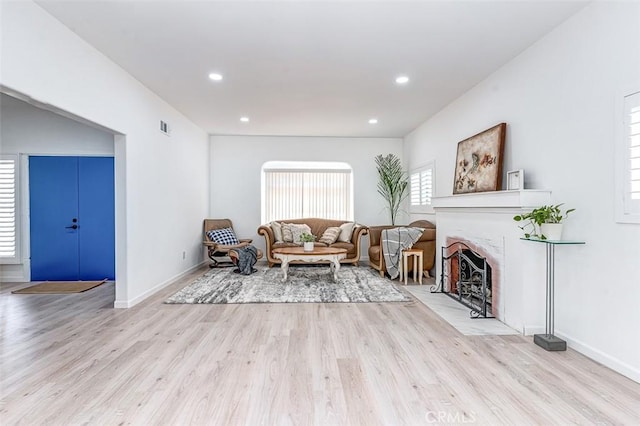 715 S Norton Ave, Los Angeles, CA 90005 - living room featuring wood finished floors, recessed lighting, and a fireplace with flush hearth