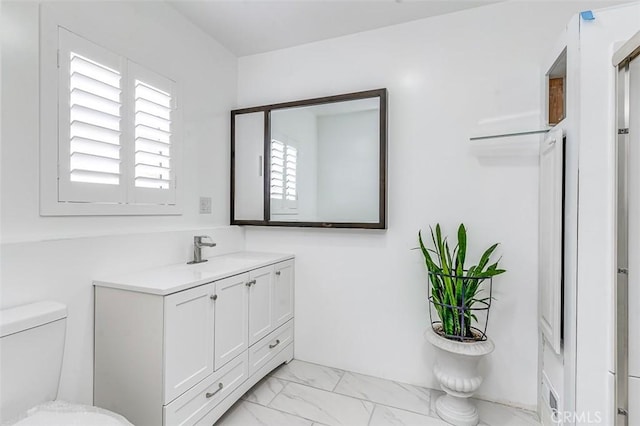 715 S Norton Ave, Los Angeles, CA 90005 - bathroom with vanity and marble look tile flooring