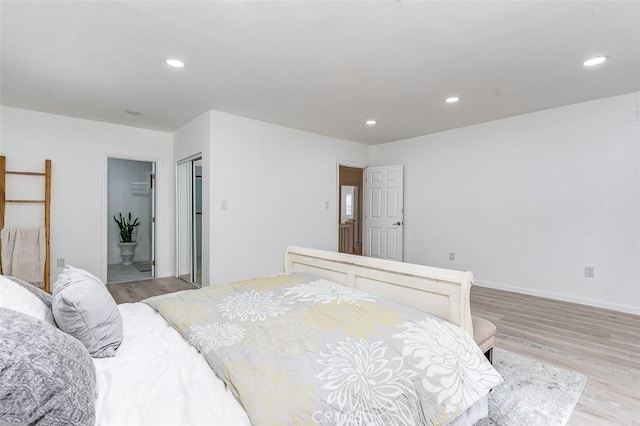715 S Norton Ave, Los Angeles, CA 90005 - bedroom with light wood-style floors, recessed lighting, and ensuite bathroom