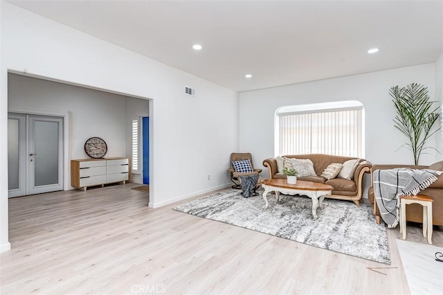715 S Norton Ave, Los Angeles, CA 90005 - living room with light wood-style flooring and recessed lighting