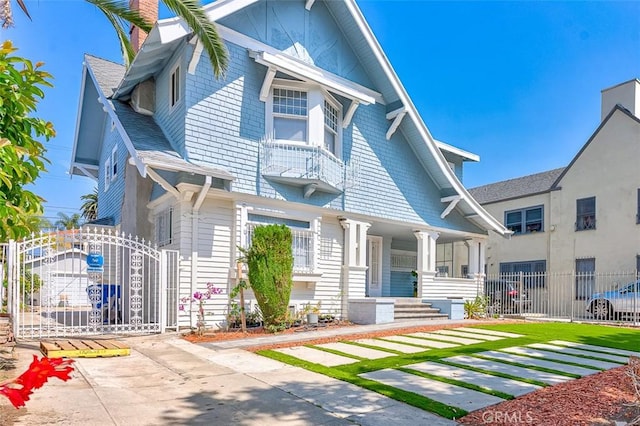 715 S Norton Ave, Los Angeles, CA 90005 - view of front of property with covered porch and a gate