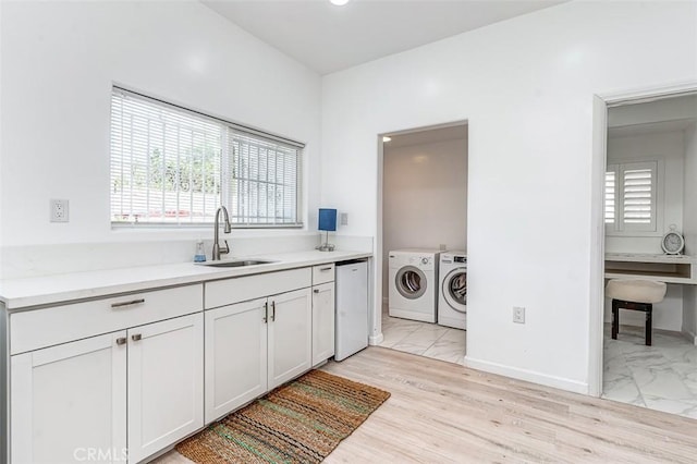 715 S Norton Ave, Los Angeles, CA 90005 - laundry area with washing machine and dryer and light marble finish floors