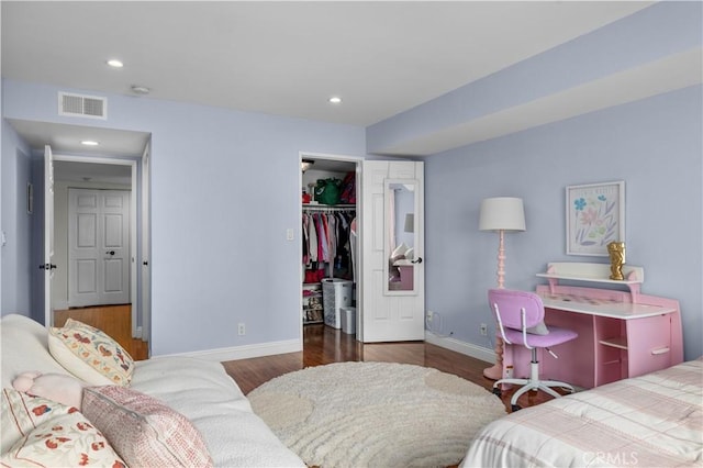 1215 Brockton Ave Unit 203, Los Angeles, CA 90025 - bedroom featuring a walk in closet, wood finished floors, a closet, and recessed lighting