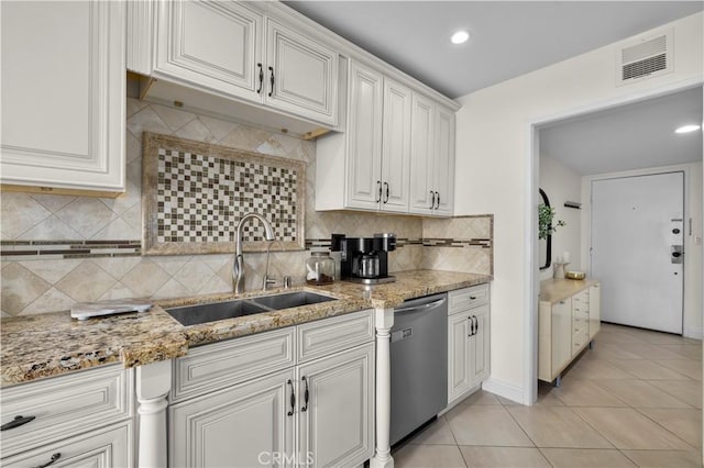 1215 Brockton Ave Unit 203, Los Angeles, CA 90025 - kitchen with dishwasher, tasteful backsplash, light stone counters, light tile patterned floors, and recessed lighting