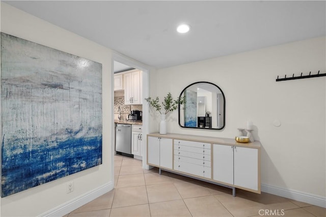 1215 Brockton Ave Unit 203, Los Angeles, CA 90025 - hallway with light tile patterned floors and recessed lighting