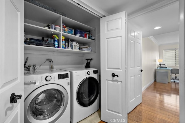 1215 Brockton Ave Unit 203, Los Angeles, CA 90025 - washroom featuring crown molding, washer and dryer, and light wood finished floors