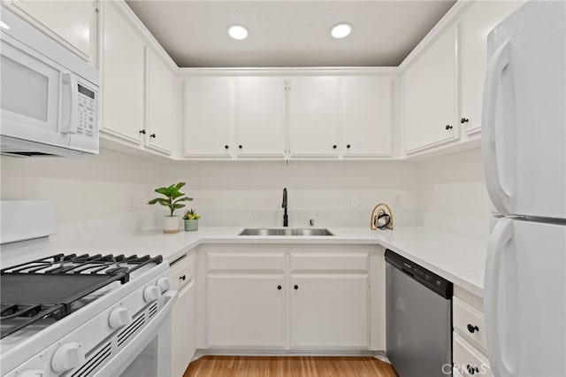 22832 Hilton Head Dr Unit 98, Diamond Bar, CA 91765 - kitchen with white appliances, light countertops, white cabinets, recessed lighting, and light wood finished floors
