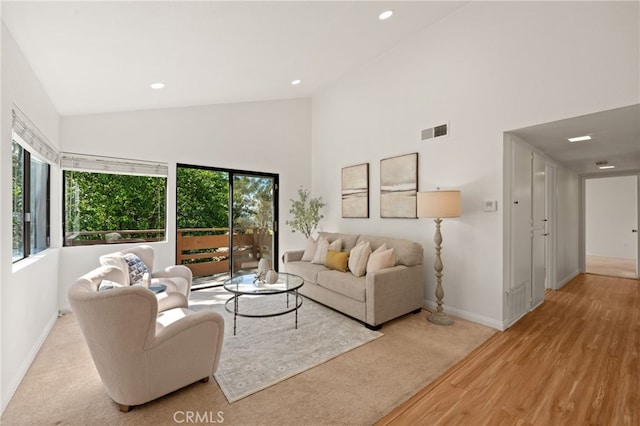 22832 Hilton Head Dr Unit 98, Diamond Bar, CA 91765 - living area featuring high vaulted ceiling, recessed lighting, wood finished floors, and carpet