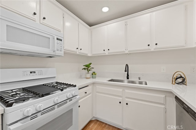 22832 Hilton Head Dr Unit 98, Diamond Bar, CA 91765 - kitchen with white appliances, light countertops, white cabinets, light wood-style flooring, and recessed lighting