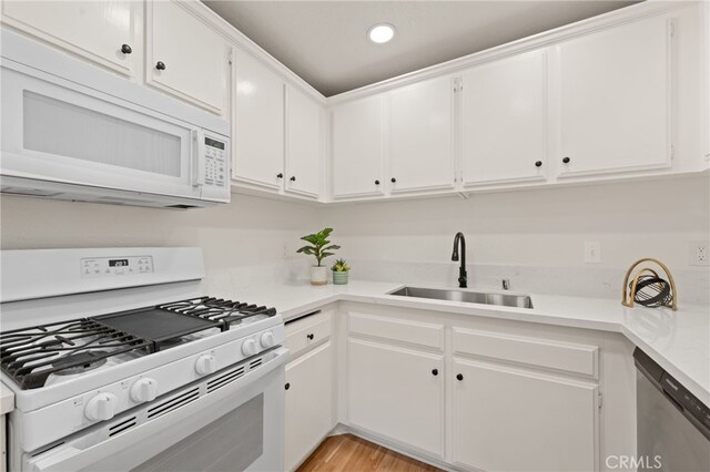 22832 Hilton Head Dr Unit 98, Diamond Bar, CA 91765 - kitchen with white appliances, light countertops, white cabinetry, light wood-style floors, and recessed lighting