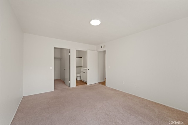 22832 Hilton Head Dr Unit 98, Diamond Bar, CA 91765 - unfurnished bedroom with light carpet, a walk in closet, ensuite bathroom, and a closet