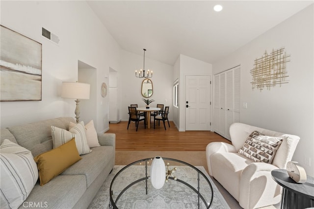 22832 Hilton Head Dr Unit 98, Diamond Bar, CA 91765 - living room featuring wood finished floors, a chandelier, vaulted ceiling, and recessed lighting