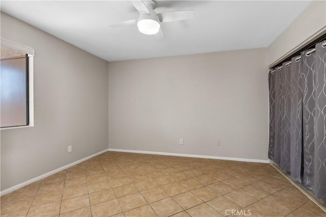 1339 Massachusetts Ave Unit 101, Riverside, CA 92507 - empty room featuring a ceiling fan and light tile patterned floors