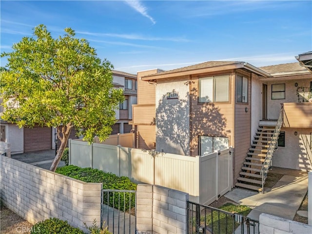 1339 Massachusetts Ave Unit 101, Riverside, CA 92507 - view of property with a gate and stairway