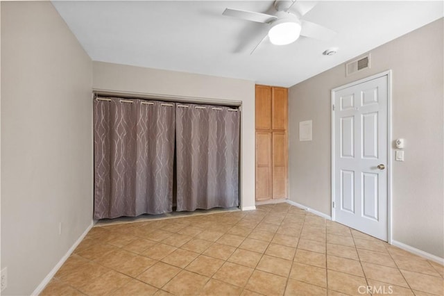 1339 Massachusetts Ave Unit 101, Riverside, CA 92507 - empty room with a ceiling fan, light tile patterned flooring, and a smoke detector