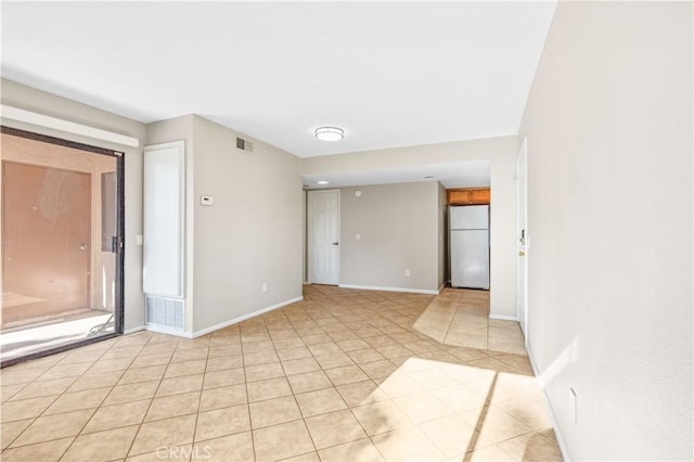 1339 Massachusetts Ave Unit 101, Riverside, CA 92507 - empty room featuring light tile patterned floors and baseboards