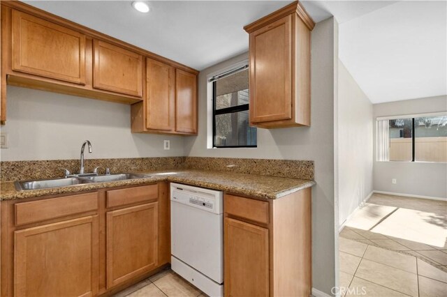 1339 Massachusetts Ave Unit 101, Riverside, CA 92507 - kitchen featuring dishwasher, light tile patterned floors, brown cabinets, recessed lighting, and light stone countertops