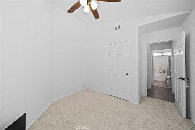 2908 Owens Way, Rosamond, CA 93560 - unfurnished bedroom featuring light colored carpet, a ceiling fan, and lofted ceiling
